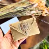 Handcrafted beige suede card holder with natural rose quartz gemstone. Ready to ship worldwide. Handmade in Portugal by Siga Tribal.