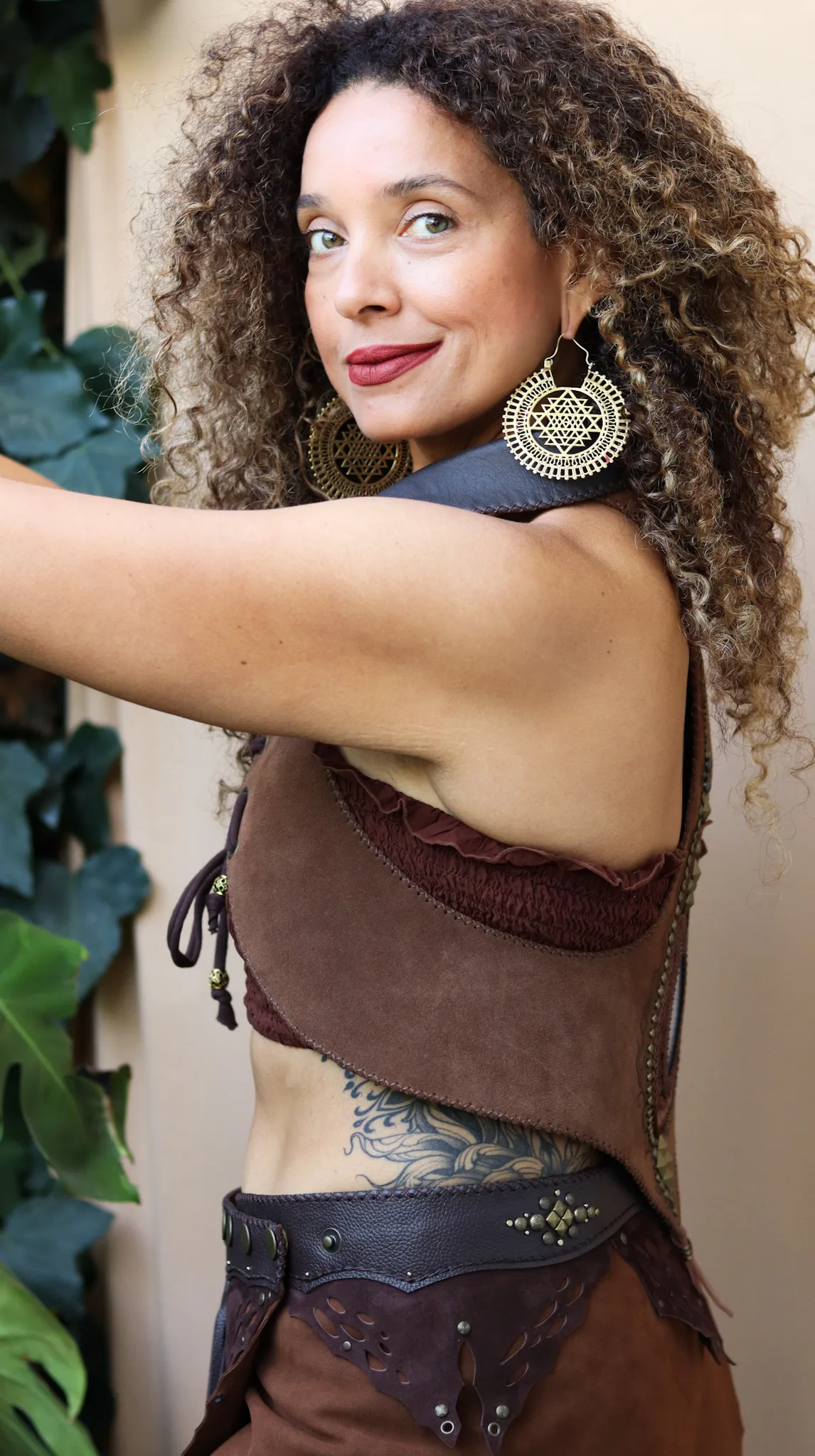 handmade earth-toned brown suede vest with natural agate gemstone and antique gold details by Siga Tribal