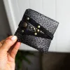 Handmade ORIN leather wallet with snake-embossed texture and antique gold studs