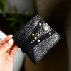 Handmade ORIN leather wallet with snake-embossed texture and antique gold studs