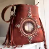 Artisan leather talisman bag with fringe and metal details
