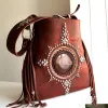 Artisan leather talisman bag with fringe and metal details