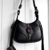 Black leather bag with sculptural design and natural stone detail. Handmade in Portugal. Ready to ship.
