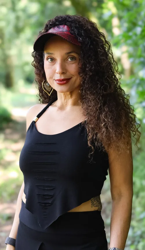 Black asymmetrical halter top by Siga Tribal with handcrafted slashed detail