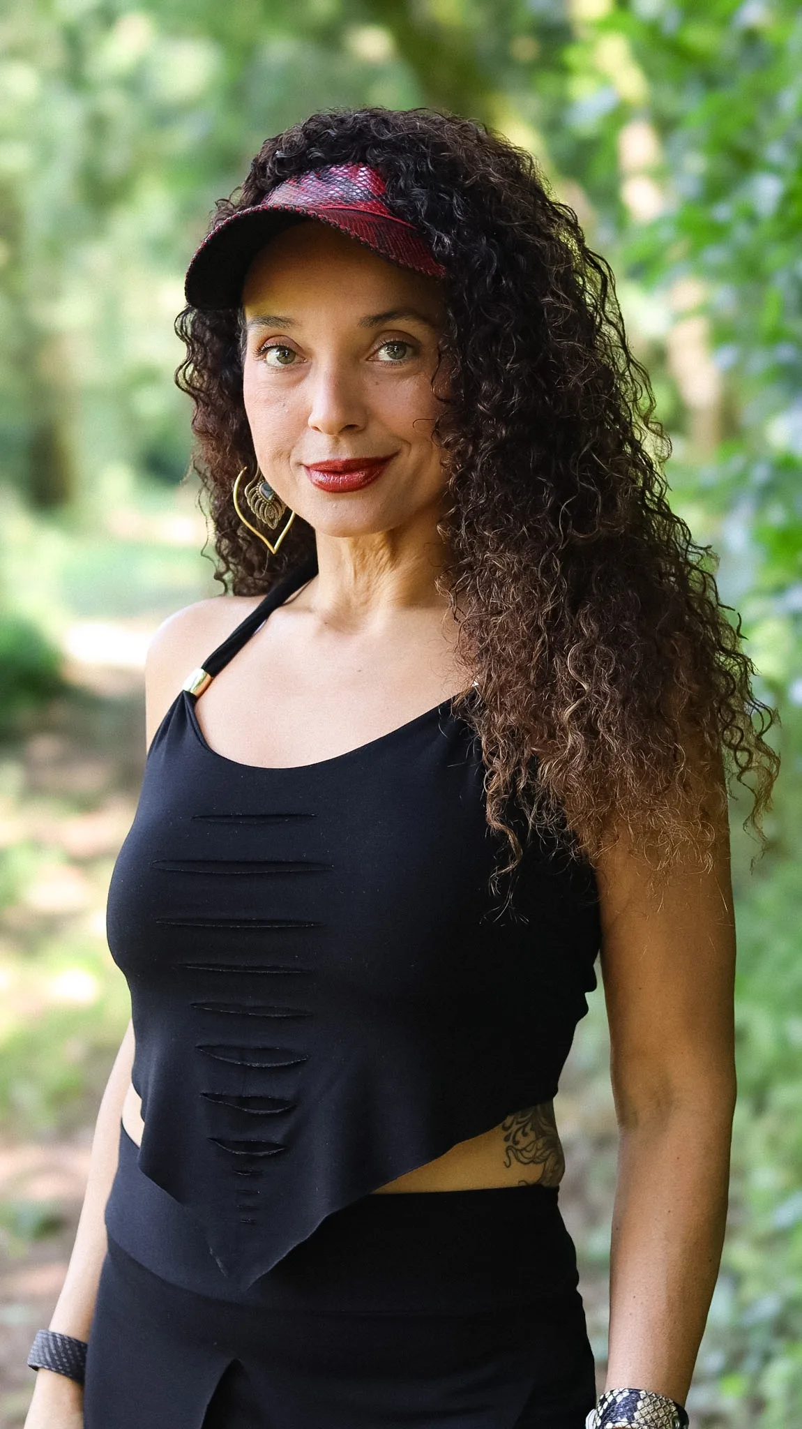 Black asymmetrical halter top by Siga Tribal with handcrafted slashed detail