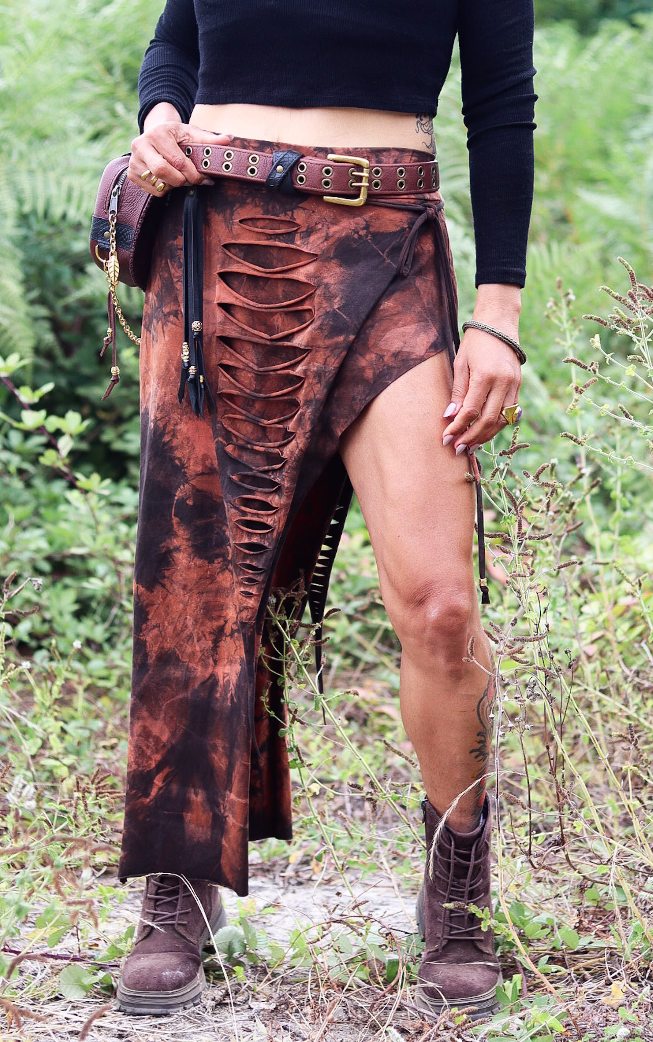 Close-up of the ONYX brown and black acid-wash maxi skirt with cut-out details by SIGA TRIBAL